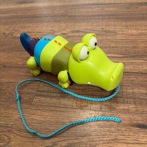 B. Toys Pull Along Crocodile Green Gross Motor Skills Cause and Effect Learning